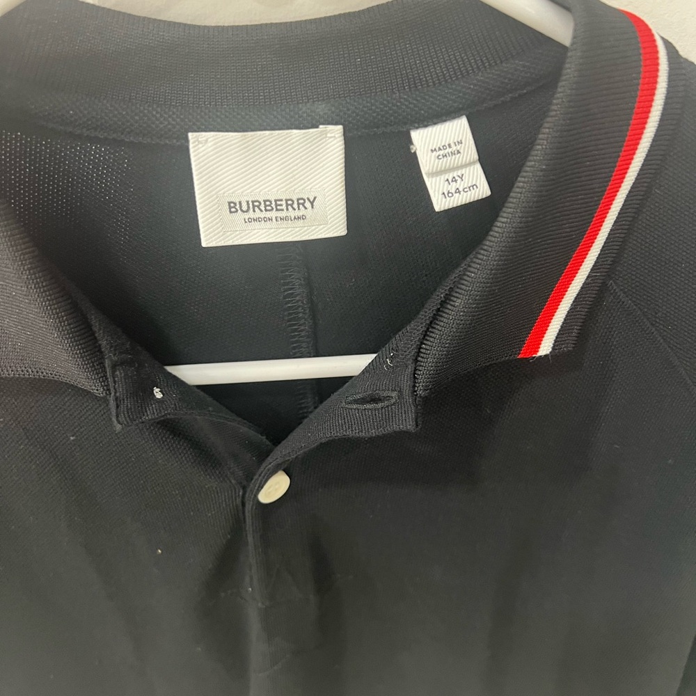 Burberry polo shirt for boys. Size 14 and the color is black and white. - Picture 3 of 4